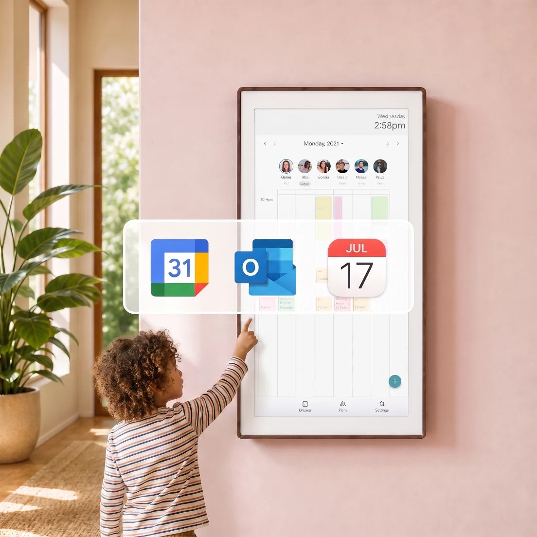 A young girl in front of a pink wall, touching or swiping colorful cards on a smart screen to view daily tasks or schedules.