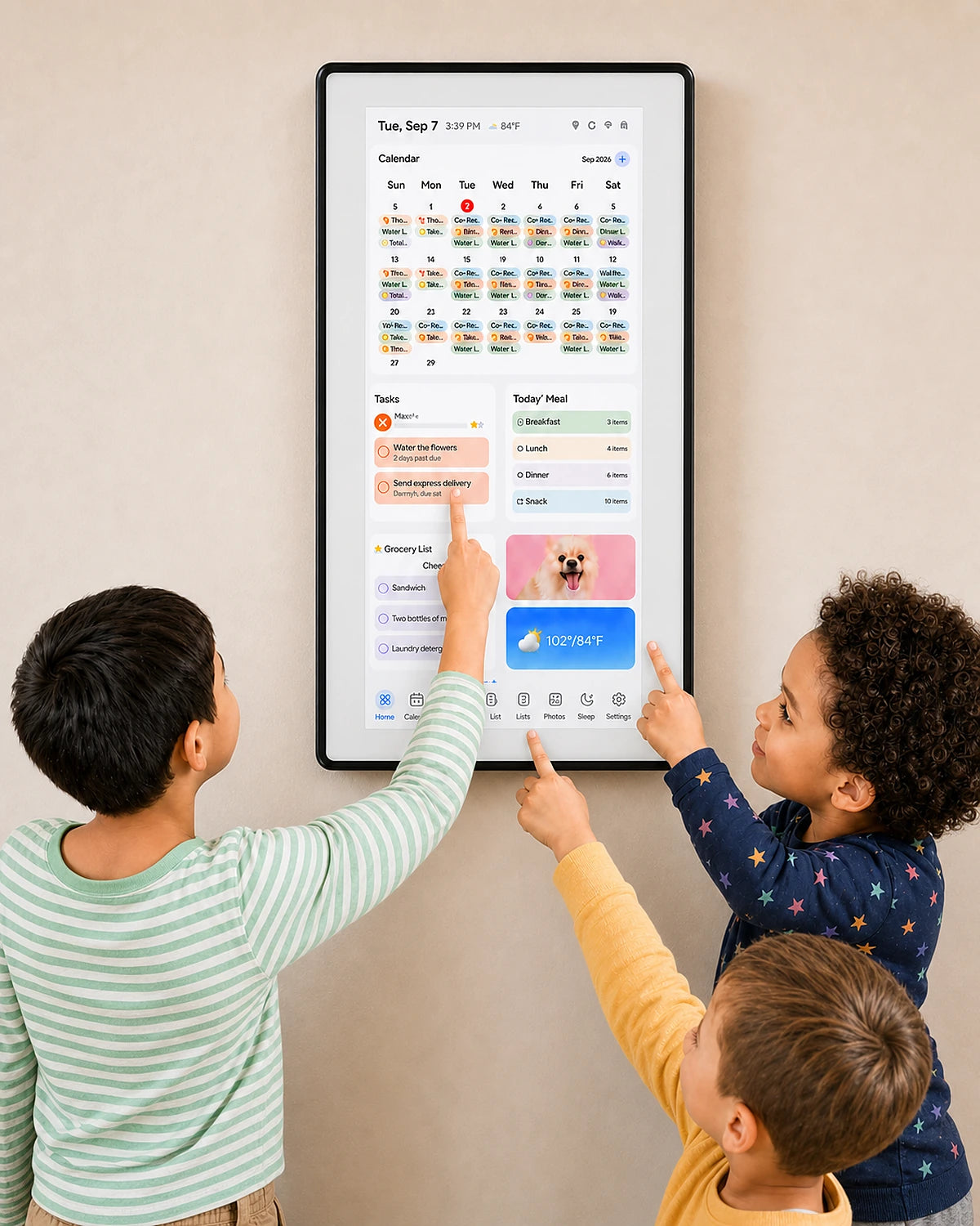 Three children selecting tasks on a wall-mounted smart family calendar