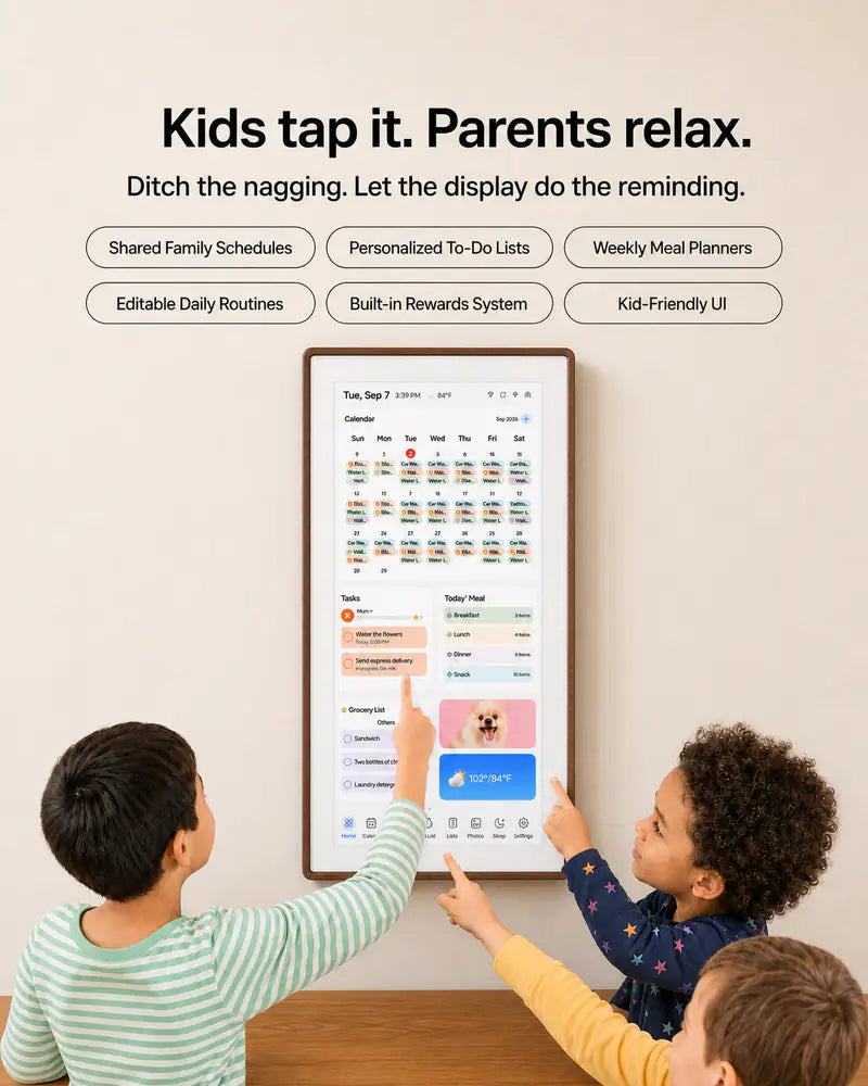 Three children using a walnut-framed family display with a shared calendar, tasks, meal plans, routines, and rewards.